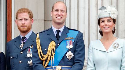 Prince Harry, Duke of Sussex, Prince William and Catherine, Princess of Wales watch a flypast to mark the centenary of the Royal Air Force from the balcony of Buckingham Palace on July 10, 2018