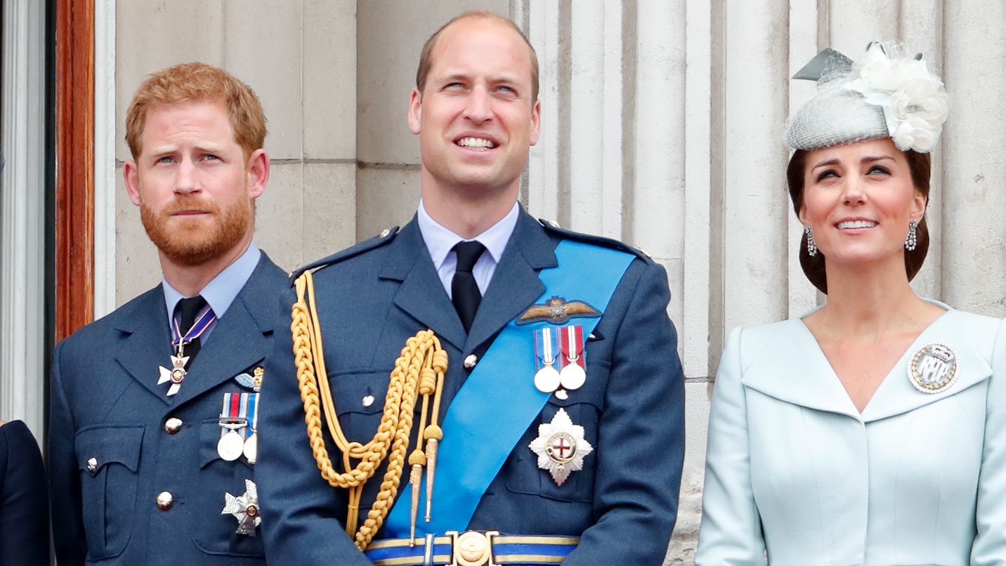 Prince Harry, Duke of Sussex, Prince William and Catherine, Princess of Wales watch a flypast to mark the centenary of the Royal Air Force from the balcony of Buckingham Palace on July 10, 2018