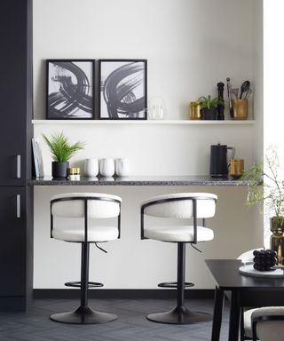 Mono kitchen scheme with coffee making cum home working area and curve style bar stools..