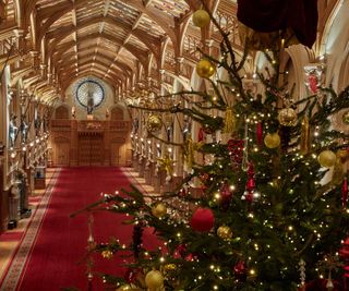 View from behind The main christmas tree in St Georges Hall, Windsor looking down the hall
