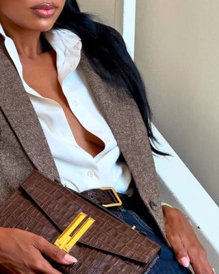 An image of Jas Tookes wearing a quiet luxury bag.