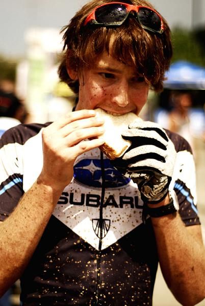 Sam Schultz chows down on a sandwich