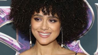 Nathalie Emmanuel pictured with very tightly coiled curly hair