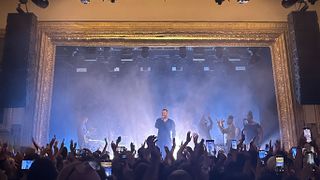 The stage at the historic Warsaw in Brooklyn with a rocker singer to the crowd.