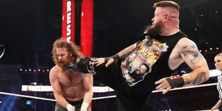 Kevin Owens kicking Sami Zayn at WrestleMania 37
