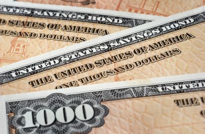 Close up photograph of U.S. Savings Bonds, selective focus.