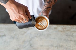 Midsection Of Man Holding Coffee - stock photo