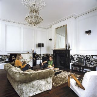 living room with white wall and sofa set