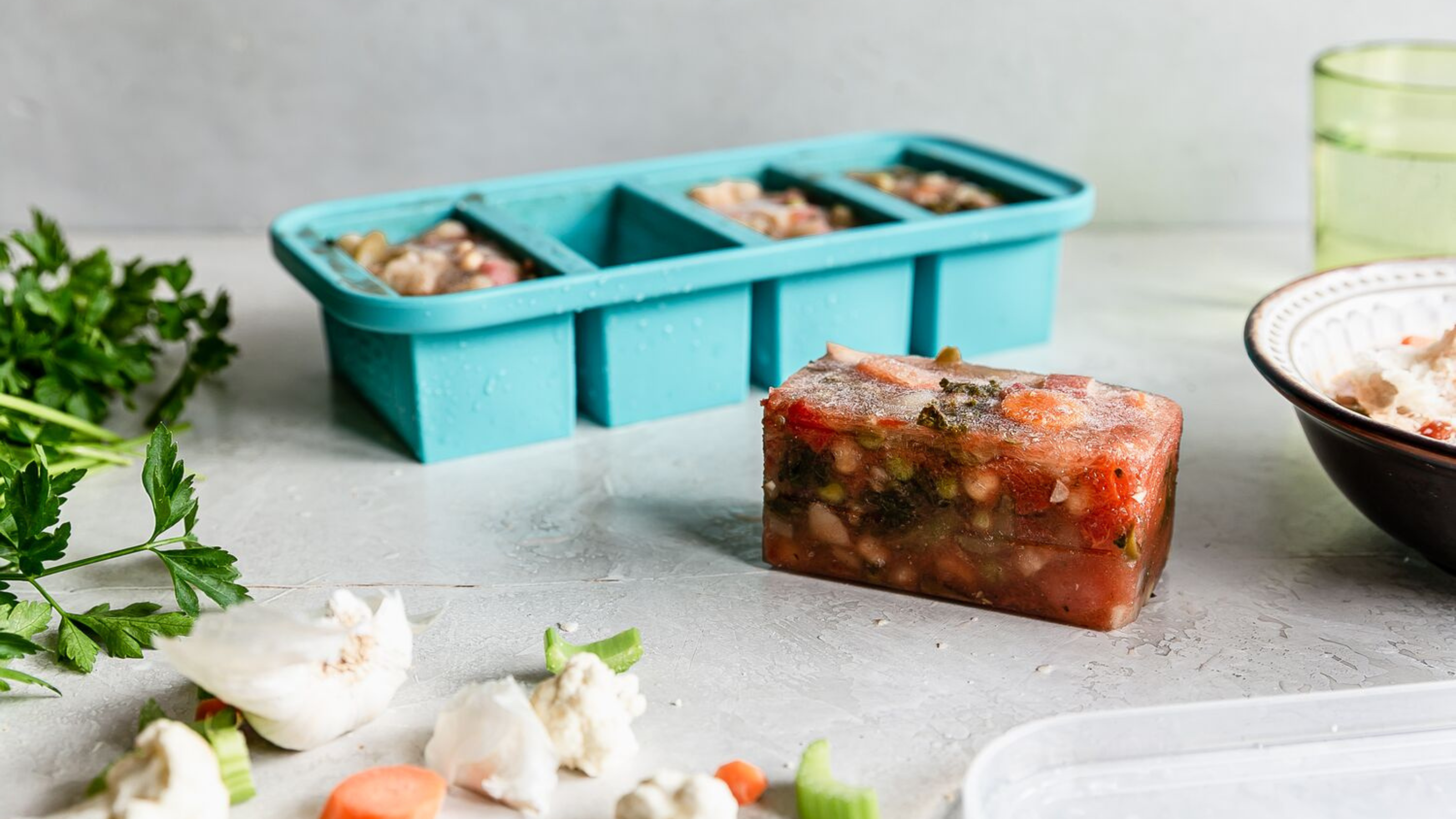 Frozen meal from souper cube mould. Super cube is in the background of the image.