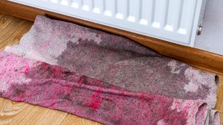 Leaking radiator onto towel on floor