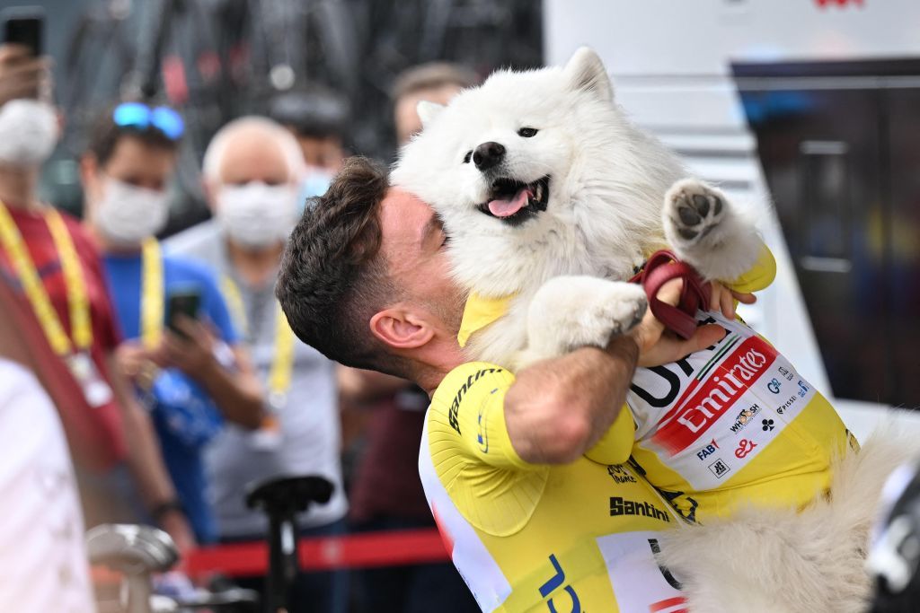 British Adam Yates of UAE Team Emirates and his dog wearing the yellow jersey of leader in the overall ranking pictured at the start of the second stage of the Tour de France cycling race a 2089 km race from VitoriaGasteiz to San Sebastian Spain Sunday 02 July 2023 This years Tour de France takes place from 01 to 23 July 2023 BELGA PHOTO JASPER JACOBS Photo by JASPER JACOBS BELGA MAG Belga via AFP Photo by JASPER JACOBSBELGA MAGAFP via Getty Images