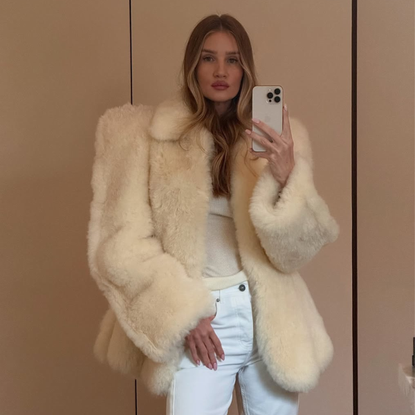 @rosiehw wears shearling jacket white jeans