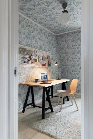 a room with wallpapered walls and ceilings