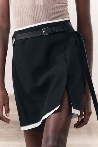 black and white mini skirt on zara model