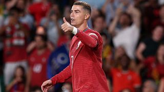Cristiano Ronaldo, wearing the red of Portugal, gives a thumbs up to his teammates during a match in the Nations League 2026/27