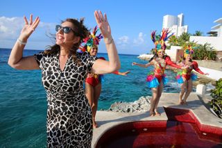 Jane dancing alongside local carnival dancers in Cozumel