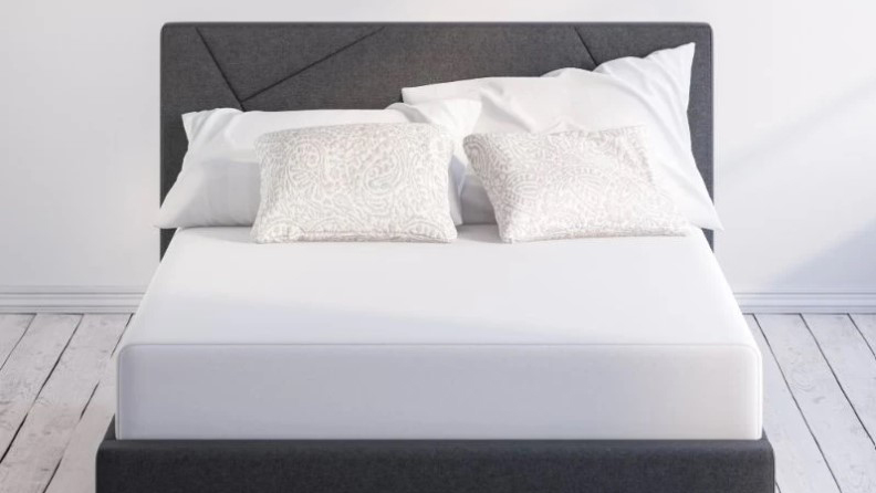 best mattress in a box: the Zinus Pressure Relief Green Tea Memory Foam Mattress in white shown on a dark bed frame
