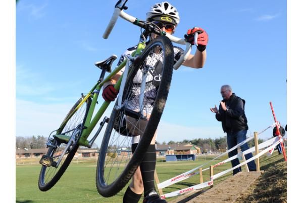 An elite women's rider charges up the stairs.