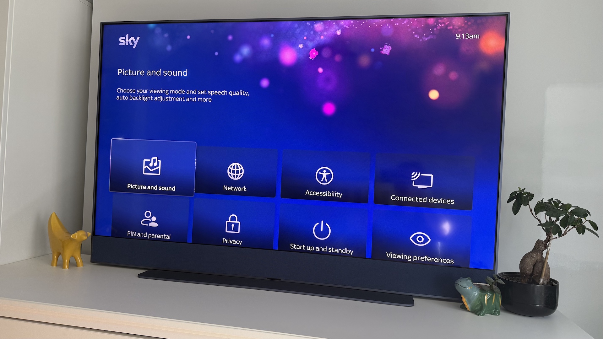 The Sky Glass Gen 2 screen on a white cabinet