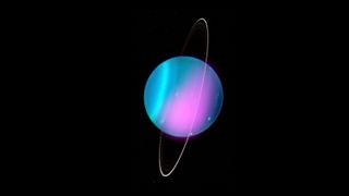 Uranus in X-rays with a distinct pink hue.
