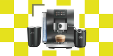 Image of a black Jura Z10 coffee machine on top of a white and chartreuse yellow checkerboard background.