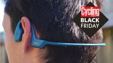 Shokz OpenRun Pro headphones on a mans head from behind with the Cycling Weekly black Friday deals logo