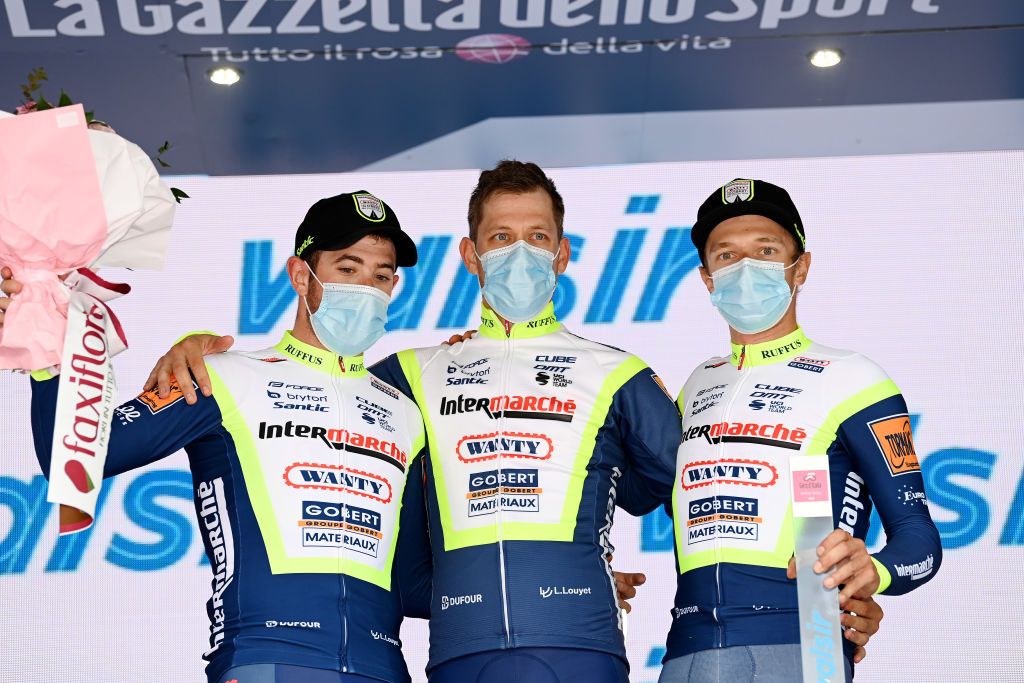 CANALE ITALY MAY 10 Riccardo Minali of Italy Wesley Kreder of Netherlands Quinten Hermans of Belgium and Team Intermarch Wanty Gobert Matriaux celebrates at podium Super team Trophy during the 104th Giro dItalia 2021 Stage 3 a 190km stage from Biella to Canale Mask Covid safety measures girodiitalia Giro on May 10 2021 in Canale Italy Photo by Stuart FranklinGetty Images