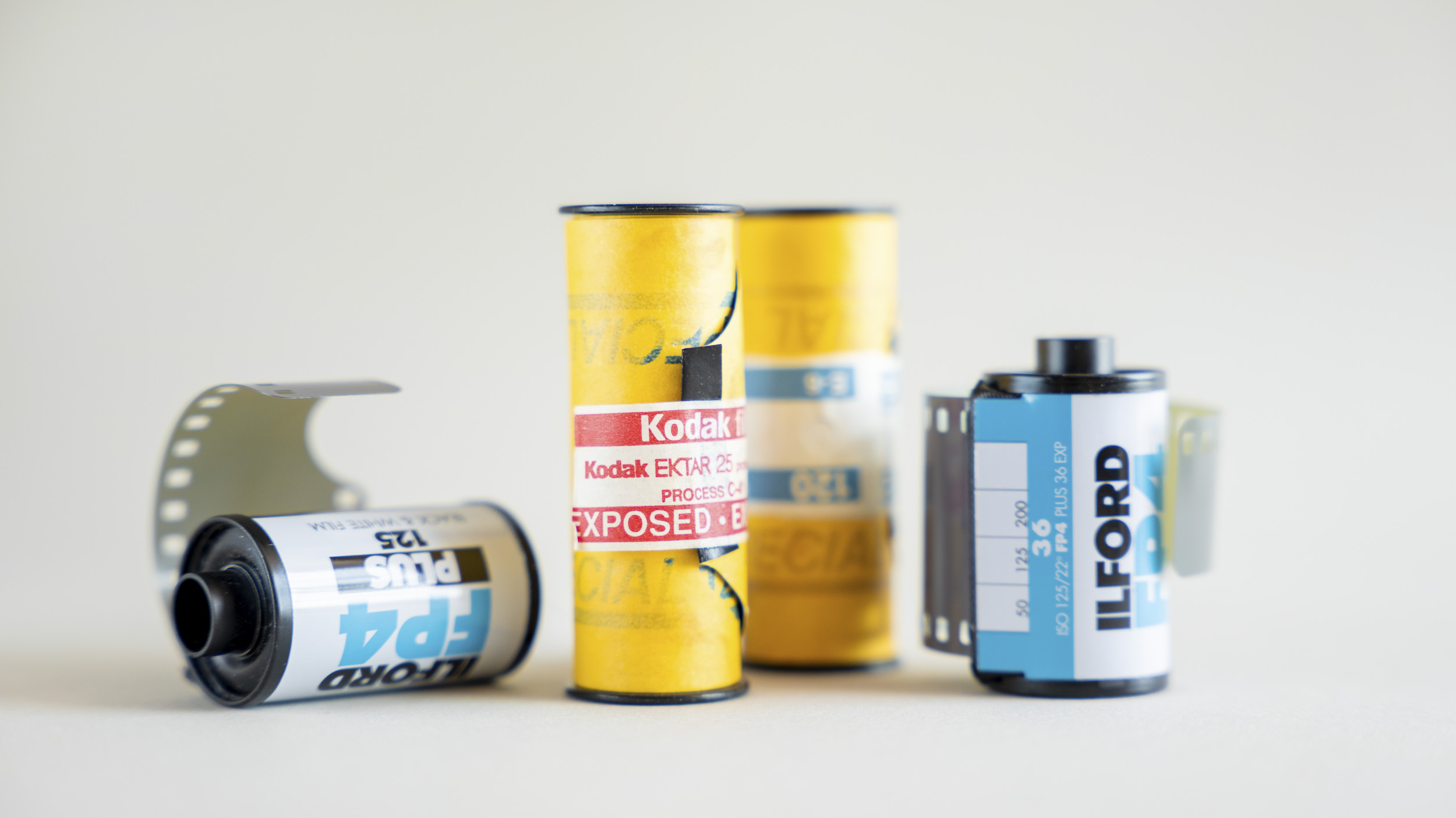 Rolls of camera film of various sizes alongside each other