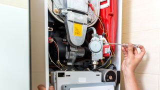 Close up of gas boiler being serviced