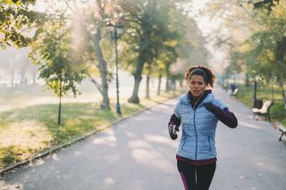 When is the best time to workout? Jogging in autumn park
