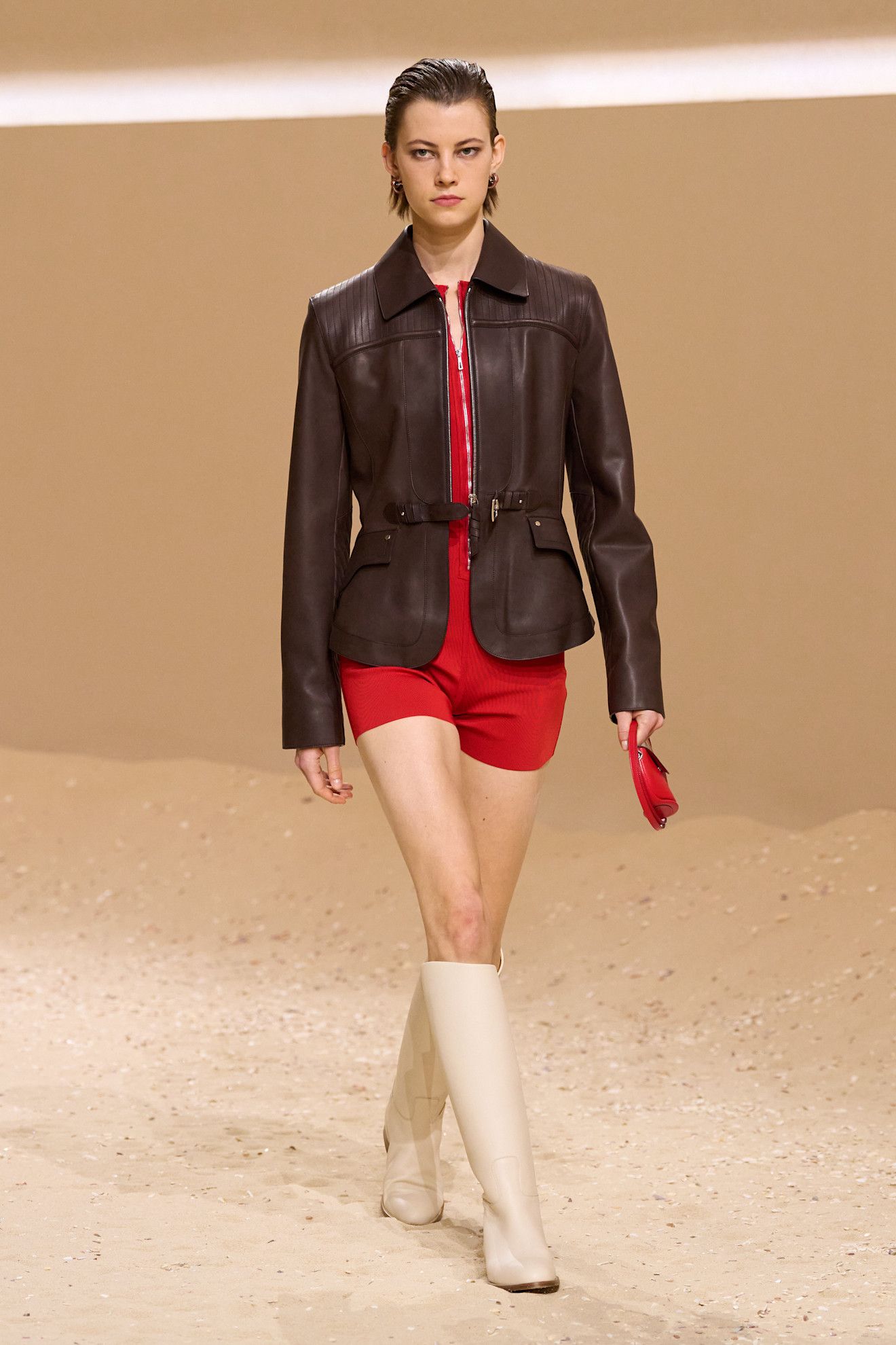 A model walks the hermes spring 2026 runway show in paris.
