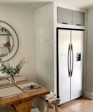 built in refrigerator with microcement walls