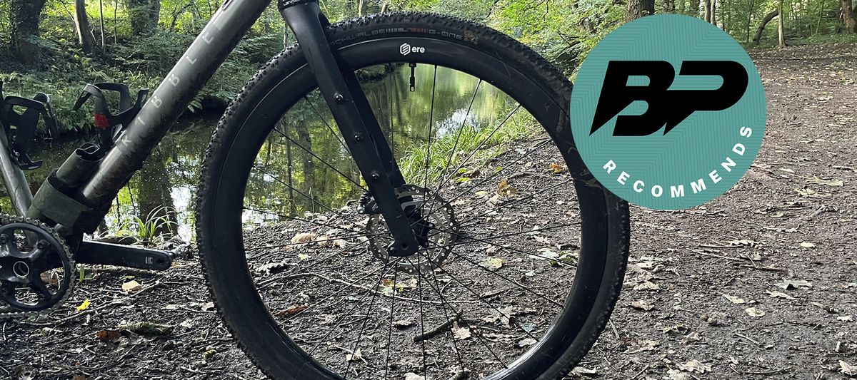 Front wheel of bike with path and river behind