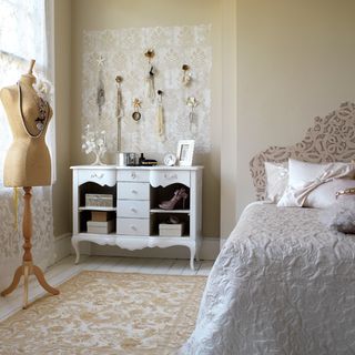 bedroom with bed and white table