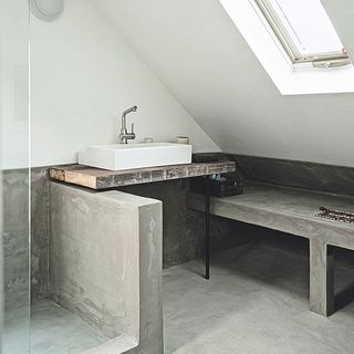 bathroom with attic ceiling and basin