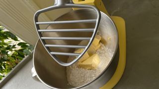 KitchenAid Pastry Blender Attachment fitted above a bowl with flour and butter in