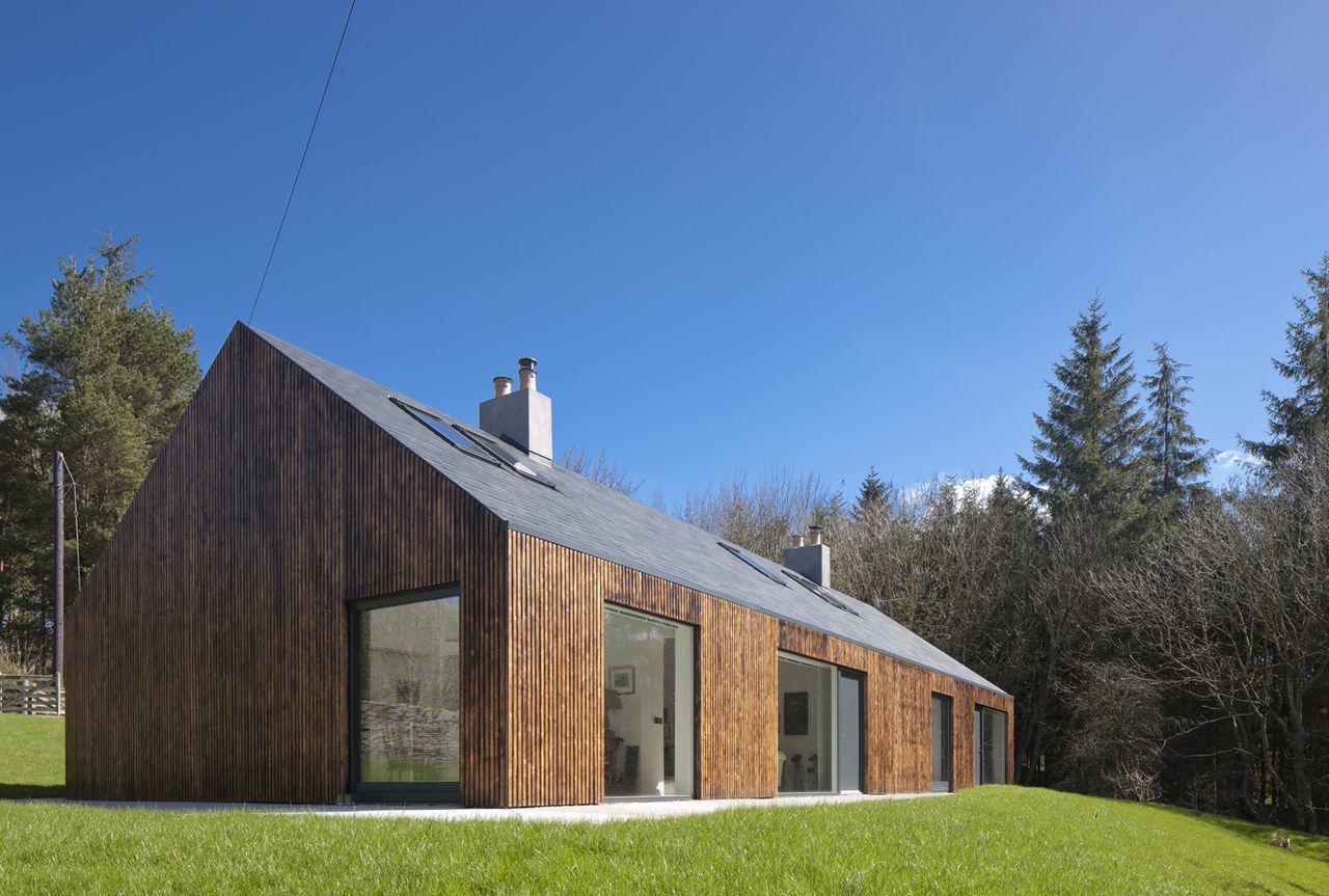 bungalow with two side extension and charred timber cladding