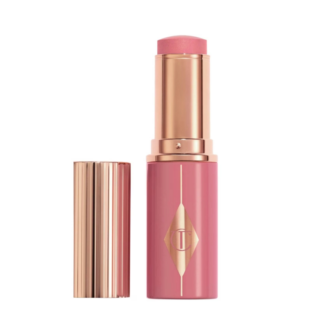 A product shot of the Charlotte Tilbury Unreal Blush Healthy Glow Stick, on a white background