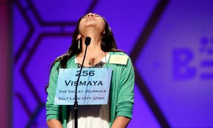Vismaya Kharkar reacts with relief after correctly spelling a word, her ticket to the final round.