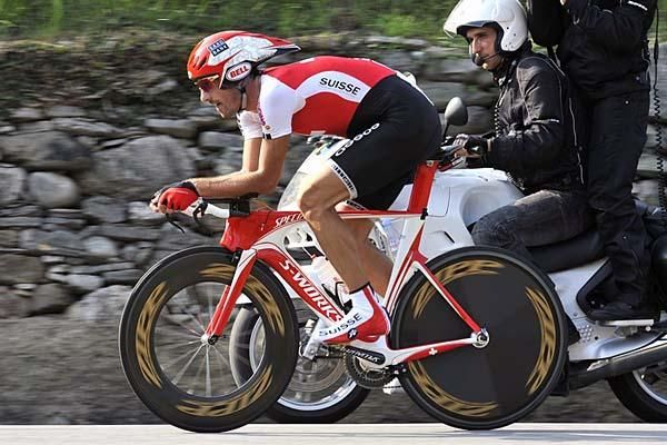 The diesel engine that is Fabian Cancellara keeps pace with the moto.