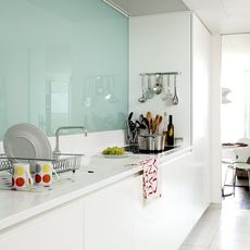 kitchen room with white tiled flooring and kitchen sink