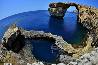 A natural arch in Malta called the Azure Window, which is shown here on May 20, 2014, collapsed in March 2017 after heavy storms hit the area. 