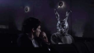 Donnie, Gretchen, and Frank in a movie theater in Donnie Darko