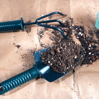 Perlite in compost with trowels