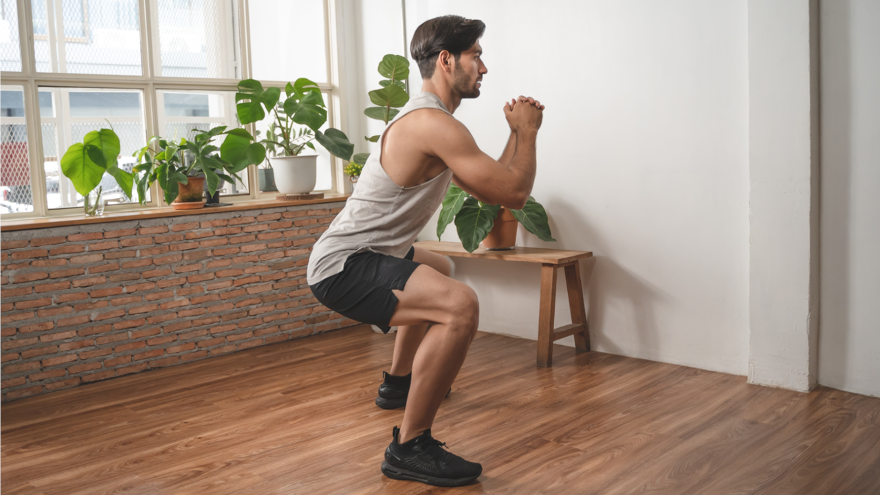 Man doing bodyweight squats