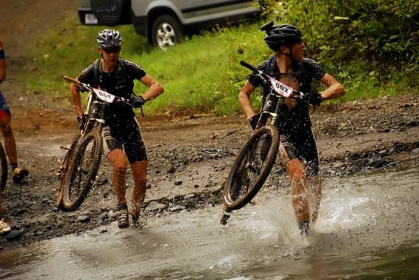 Cannondale racers run the stream crossing