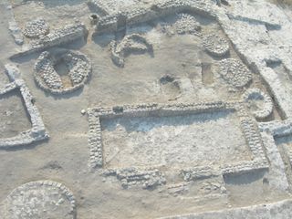 The courtyard building found at the Tel Tsaf archaeological site, with one of the silos, where a 40-year-old woman was buried inside a grave (upper left corner).