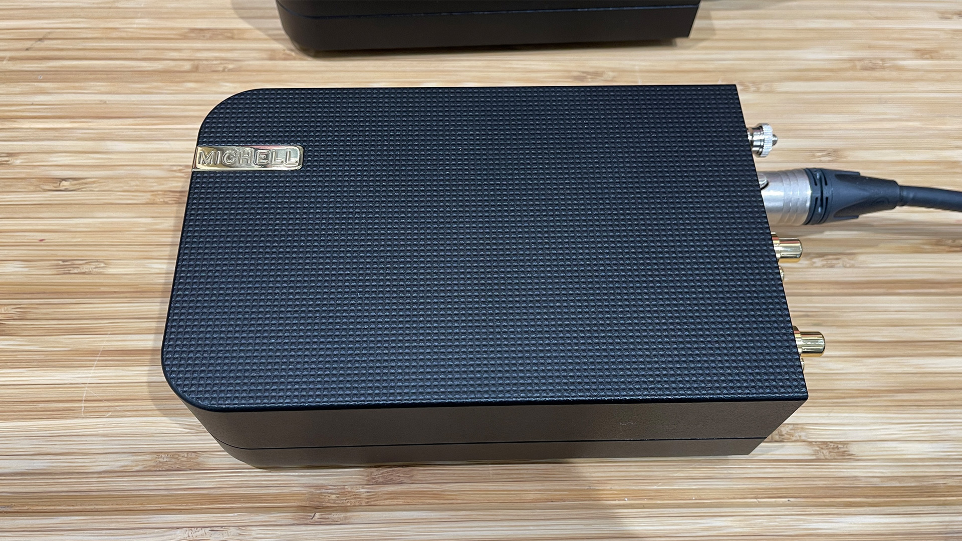 Michell Apollo phono stage on wooden hi-fi rack top down view