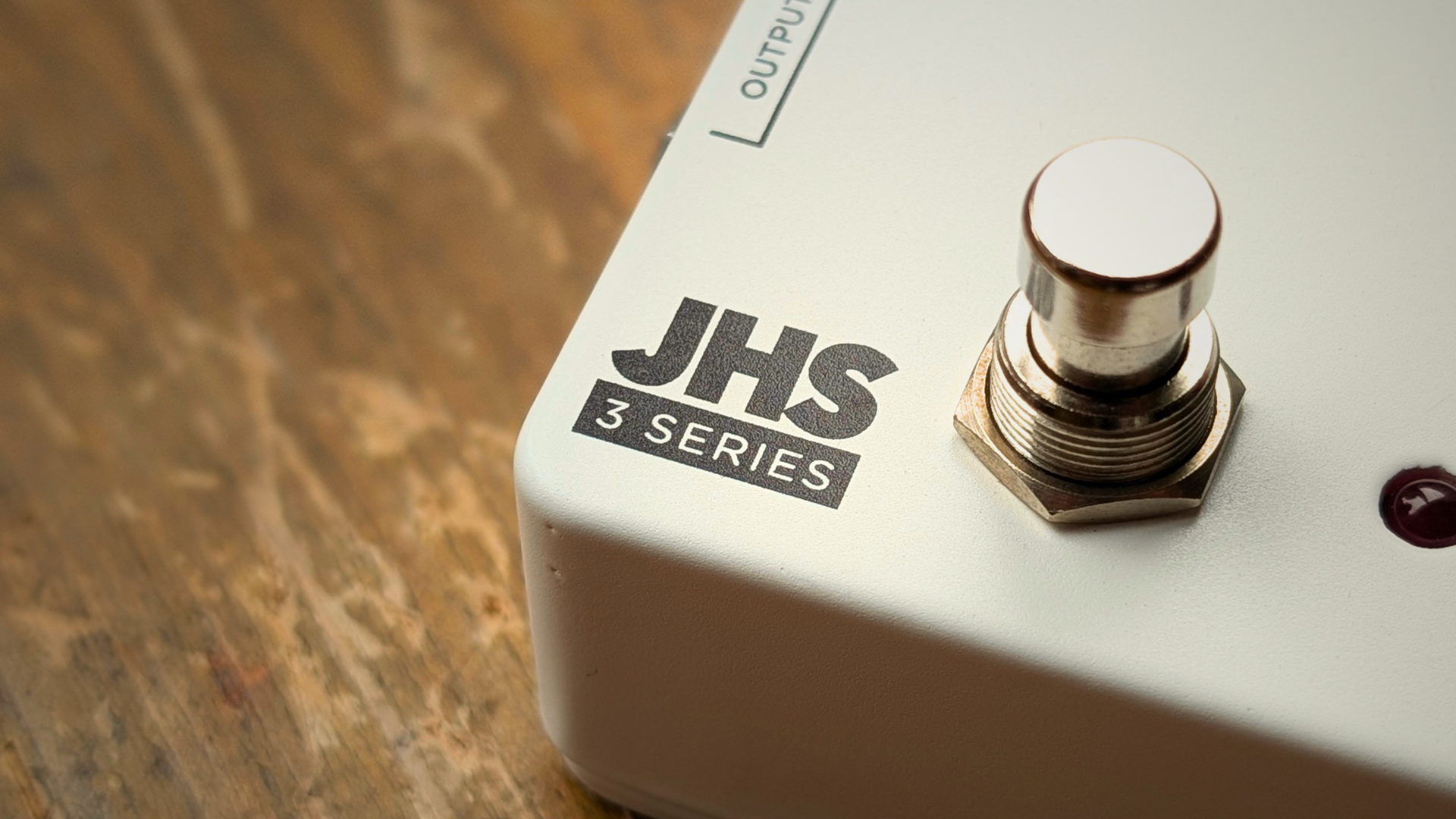 Close up of the JHS logo on the JHS 3 Series Reverb pedal