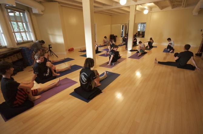 The Whole Athlete - Specialized does a twist during yoga practice